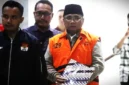 Mantan Menteri Agama, Yaqut Cholil Qoumas, saat dibawa menuju mobil tahanan di Gedung Merah Putih Komisi Pemberantasan Korupsi (KPK), Jakarta, Kamis (12/3/2026). (Liputan6.com)