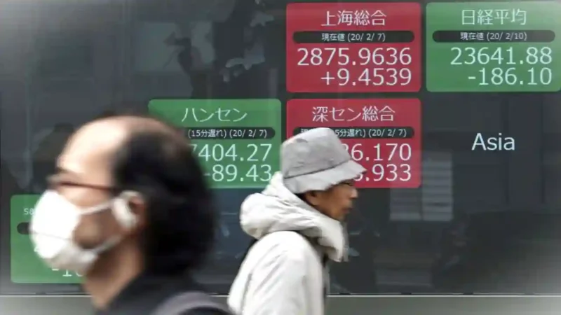 Bursa saham Asia Pasifik melonjak pada perdagangan Selasa, (24/3/2026). (AP Photo/Eugene Hoshiko)