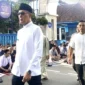 Wali Kota Sukabumi, Ayep Zaki keluar dari Kampus Universitas Muhammadiyah usai memberikan sambutan pada momen Idul Fitri Jamaah Muhammadiyah, Jumat (20/3/2026). (KOMPAS.com)