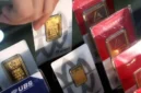 ILUSTRASI. Harga buyback oleh Logam Mulia turun Rp 36.000 per gram. (KONTAN)