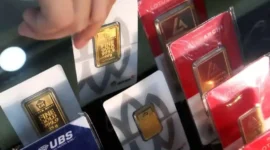 ILUSTRASI. Harga buyback oleh Logam Mulia turun Rp 36.000 per gram. (KONTAN)