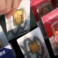 ILUSTRASI. Harga buyback oleh Logam Mulia turun Rp 36.000 per gram. (KONTAN)