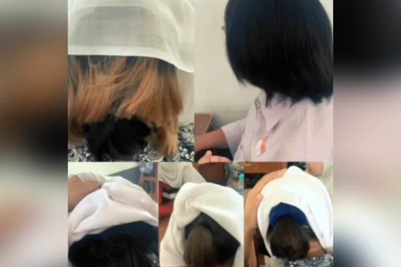 Tangkapan layar - Sejumlah siswi SMKN 2 Garut menangis usai terkena razia pemotongan rambut berwarna yang dilakukan pihak sekolah. Video tersebut kemudian viral di media sosial. (kompas.com)
