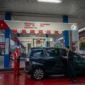 Pengendara Melakukan Pengisian BBM di SPBU.