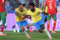 Vinicius Junior (kanan) merayakan gol pertama timnya dalam pertandingan sepak bola Grup C Piala Dunia 2026 Brasil vs Maroko di Stadion New York/New Jersey di East Rutherford pada 13 Juni 2026. (Foto oleh Jewel SAMAD / AFP)(AFP/JEWEL SAMAD)