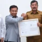 Bupati Kerinci Monadi Menerima Sertifikat Indikasi Geografis Beras Payo Kerinci.