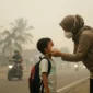 Ilustrasi - Cara Melindungi Diri dari Bahaya Kabut Asap Karhutla. (Foto: AI)